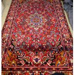 A Persian Lilihen carpet, 295 cm x 159 cm