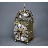 A late 19th century brass lantern clock, the 8-day two train movement signed AD Mougin, striking the