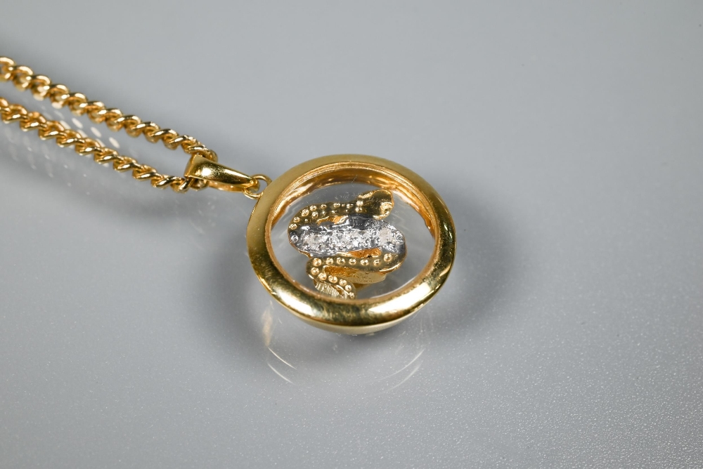 A Chopard-style 'Happy' snake pendant with rotating diamond-set serpent within, yellow metal stamped - Image 2 of 5