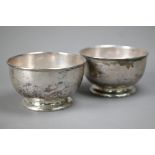 A pair of heavy silver sweetmeat bowls on raised foot-rims, Harrods Ltd, London Jubilee marked 1935,