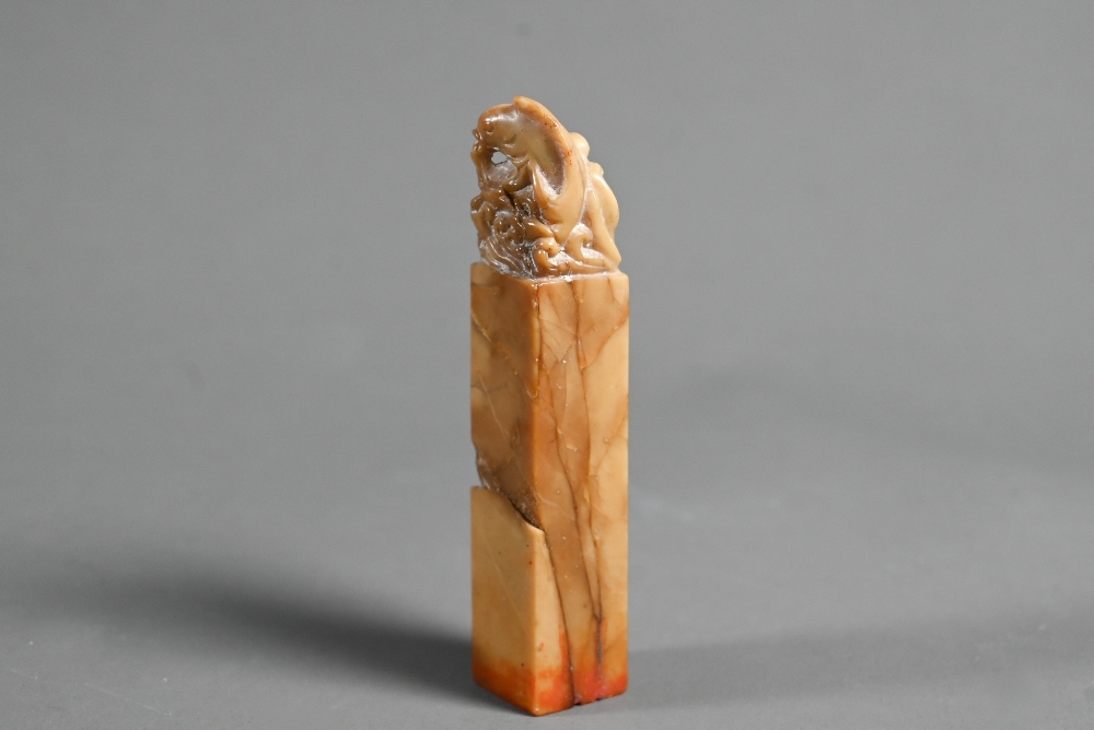 A Chinese butterscotch coloured soapstone seal carved with a carp and wave finial, four character - Image 4 of 6