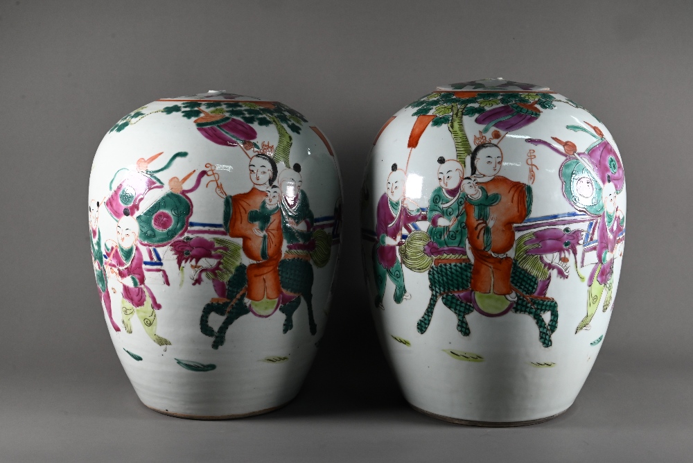 A pair of 19th century Chinese famille rose ovoid vases with covers (missing finials) painted in - Image 2 of 23
