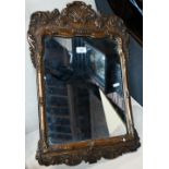 An antique giltwood and gesso framed mirror, 62 cm x 40 cm good sound overall, wear and tarnishing