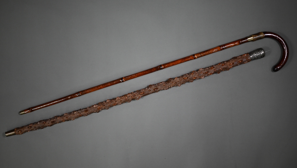 A late 19th century sword stick with hoop handle within a bamboo scabbard to/w an oriental silver