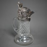 A Victorian cut glass claret jug with electroplated collar and cover surmounted by a rampant lion