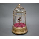 A singing bird clockwork automaton in gilt brass cage, 28 cm high