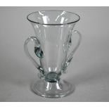 A Georgian smoky jelly glass with twin scroll handles, on domed foot with folded rim, 10.5 cm to/w