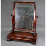 A Georgian mahogany toilet mirror, on single drawer platform base, raised on moulded scroll feet,