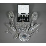 An embossed silver five-piece brush set with hand-mirror, Birmingham 1985, to/w another hand-mirror,