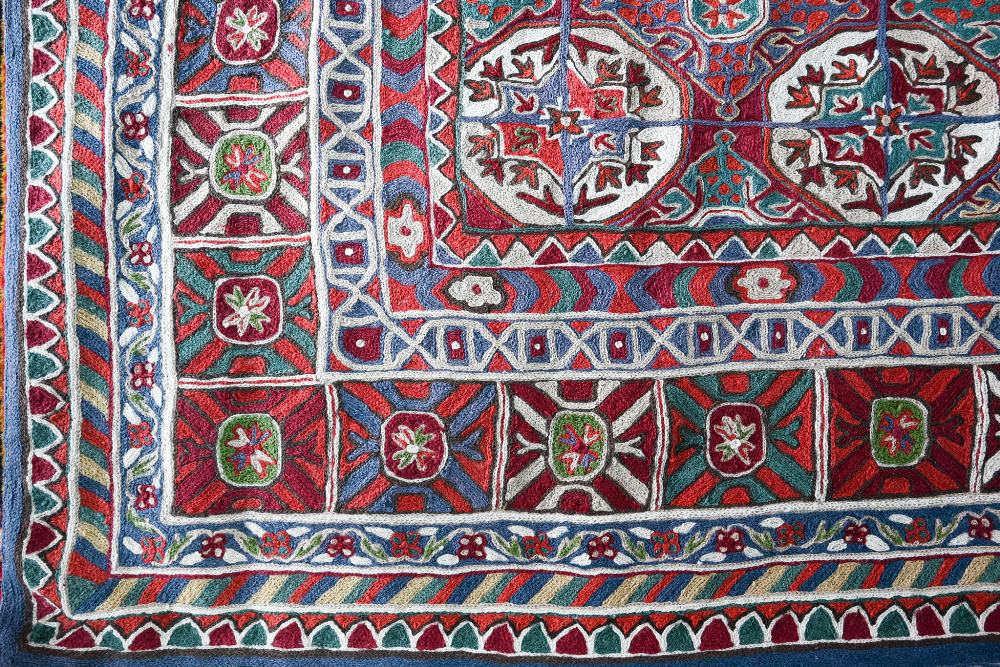 A North Indian Kashmiri Turkoman design chain-stitched rug or wall hanging, embroidered in - Image 3 of 4