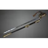 A Royal Navy officer's sword by Wilkingson of London, the badge etched with a crowned anchor, the