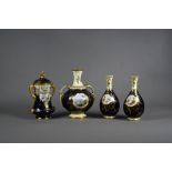 An Edwardian Coalport china miniature three piece vase garniture set with yellow necks and blue