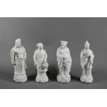 Four late 19th or early 20th century Chinese blanc-de-chine dehua porcelain figures of Daoist