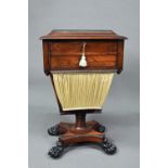 A Regency rosewood work table, the hinged top enclosing a multi-division interior over a drawer