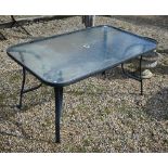 A glass top terrace table, 154 x 98 x 76 cm h