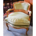 A French beech framed fauteuil armchair, with green dralon upholstery