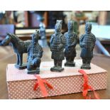 A boxed souvenir gift set of miniature terracotta figures