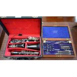A vintage cased set of drawing instruments by W H Harling Ltd, London to/w a rosewood clarinet (2)