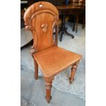 A Victorian mahogany shield back hall chair