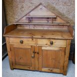 An old stripped pine dresser base, two drawers over two cupboards, 134 cm x 69 cm x 130 cm h
