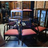 A set of seven antique mahogany dining chairs, with cross-over splats and fabric seats, comprising a