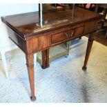 A George III mahogany fold over card table, with centre frieze drawer, raised on square tapering