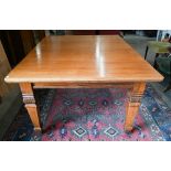 An antique mahogany extending dining table with wind-out rectangular top and two leaves (c/w leaf