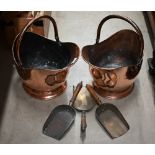 A pair of antique copper helmet scuttles with swing handles, c/w three various shovels