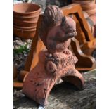 A cast terracotta squirrel ridge tile