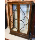 A vintage walnut glazed display cabinet with glass shelves (damage to top, cracked glass panel),
