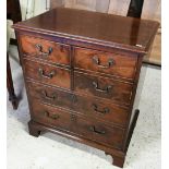 A Victorian style mahogany commode chest, with pair of cabinet doors faced as dummy drawers, on