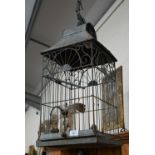 A wire and tin bird cage, 64 cm high