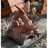 A cast terracotta dragon ridge tile