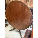 A Victorian style circular crossbanded and brass band inlaid mahogany breakfast table on four