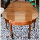 A 19th century mahogany dining table, the pair of demi lune ends united by drop leaf central