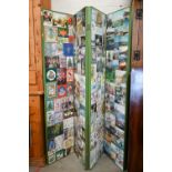 A green painted dress screen with four folding postcard mosaic panels, 170 cm high x 160 cm wide