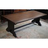 Oak refectory dining table with rectangular planked top raised on pair of shaped trestle supports