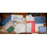 A box of various table linens including napkins, table cloths etc