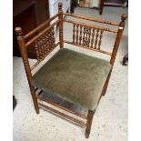 An antique bobbin turned corner chair, with fabric seat