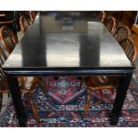 A Lombok Chinese-style black lacquered extending dining table with single central leaf, the top