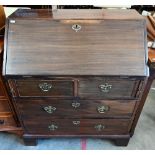 A walnut fall front bureau with two short and two long drawers standing on bracket feet, 78 cm