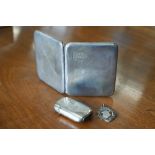 An engine-turned silver cigarette case, Birmingham 1927, to/w a vesta case, London 1894 and a silver