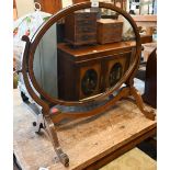 An Edwardian walnut framed oval toilet mirror to/w bevelled oval wall mirror in oak frame (2)