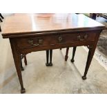 A George III mahogany folding tea table with frieze drawer and tapering square supports, 92 cm