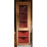 A part glazed stripped pine corner cabinet