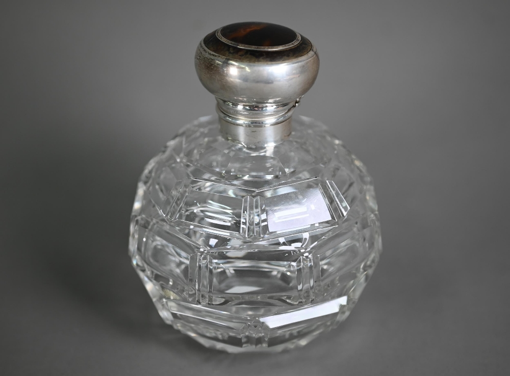 A globular cut glass scent bottle with hinged silver bun cover, Levi & Salaman, Birmingham 1916