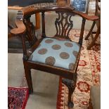 A 19th century carved mahogany corner chair