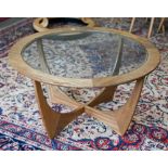 A mid-century G-Plan teak 'Astro' coffee table, circular inset glass top, Victor Wilkins design,
