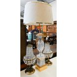 A cut glass and gilt metal table lamp of vase form, 83 cm high, to/w a pair of table lamps strung