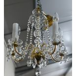 French style brass and glass five branch chandelier, with faceted drops